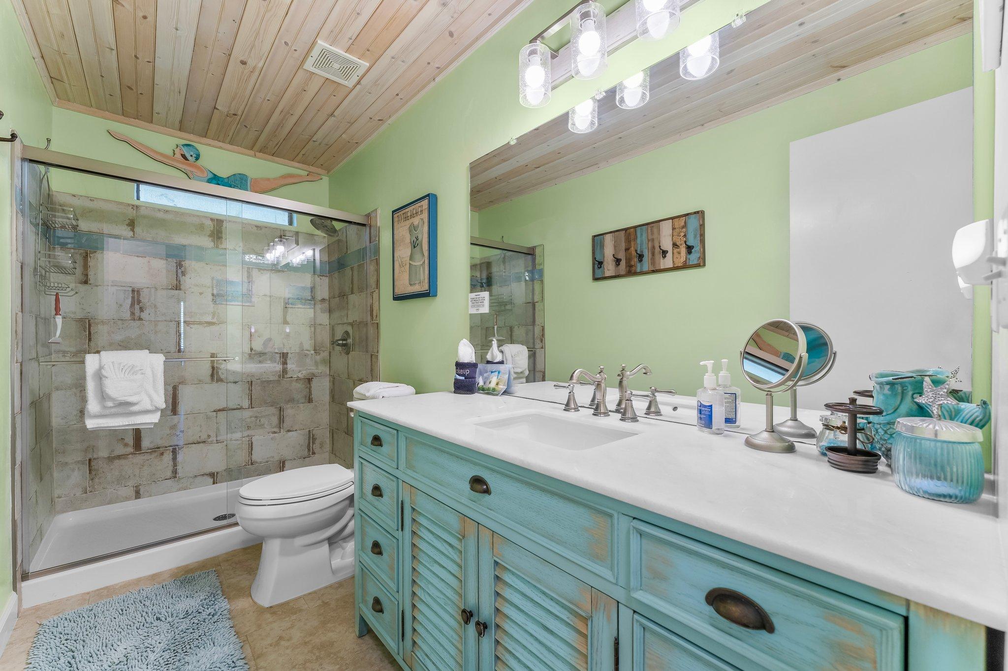 Large shower, facial mirror, and hair dryer 