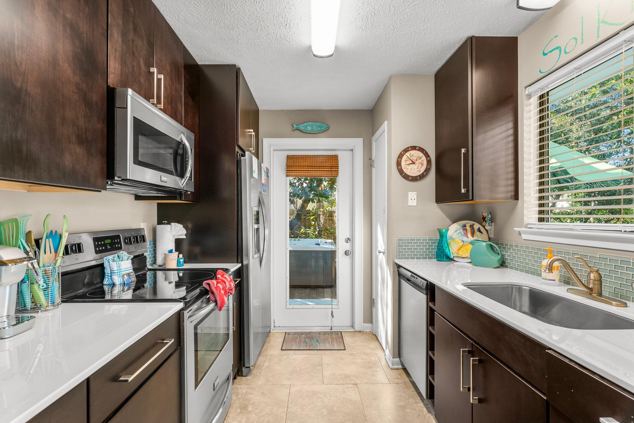 Kitchen is equipped with Stainless steel appliances,dishware and small appliances include coffee maker and Keurig 