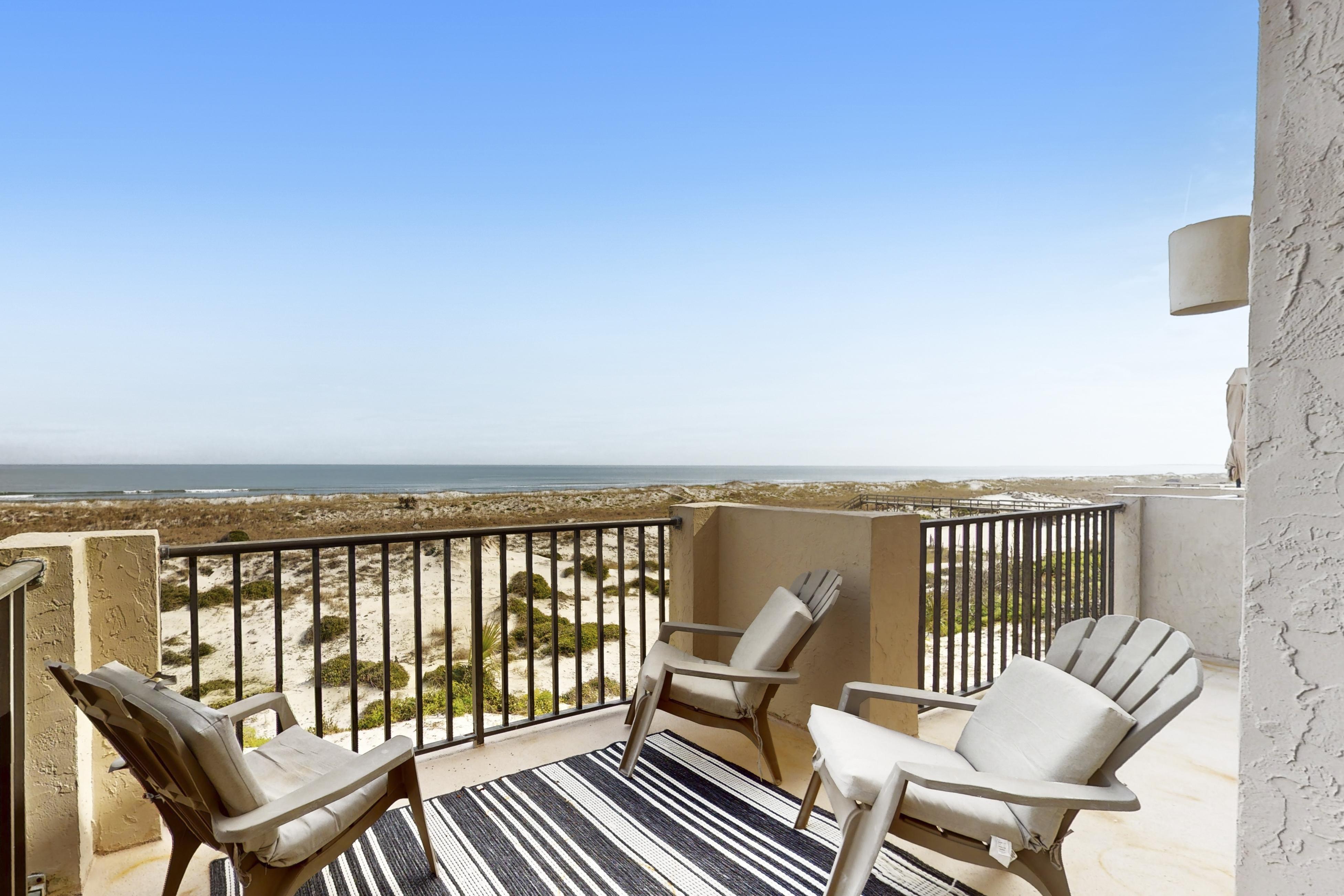 Oceanfront townhome with a furnished balcony, outdoor pool, & tennis